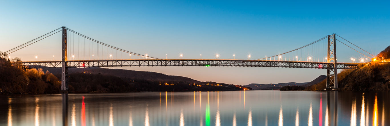 bridge across river at dusk